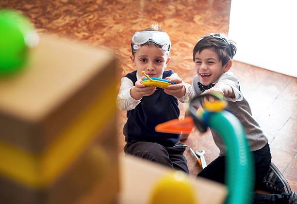 kids hand playing with colorful building blocks, toddler development concept, joy, life