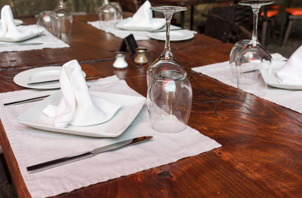 istock Restaurant table set with glasses, napkins and forks 638512224
