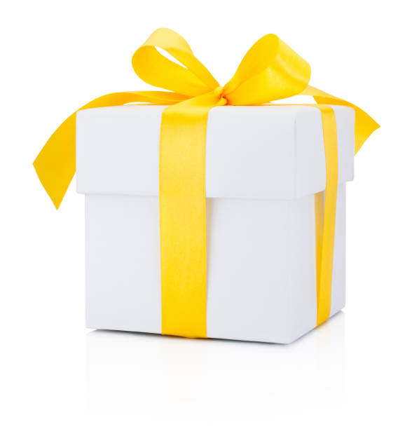 istock White gift box tied yellow ribbon Isolated on white background 638514266