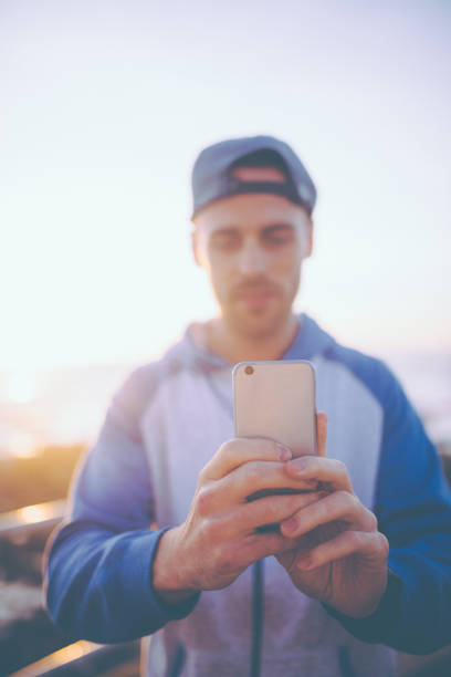 istock Young caucasian men taking photo with smart phone 638516010