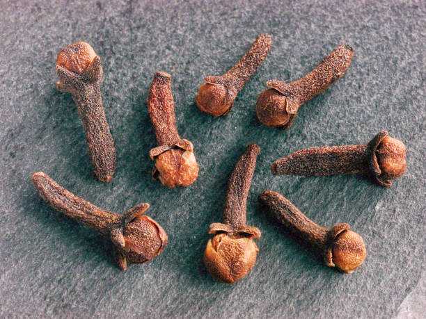 istock Cloves spice on gray slate background 638518034