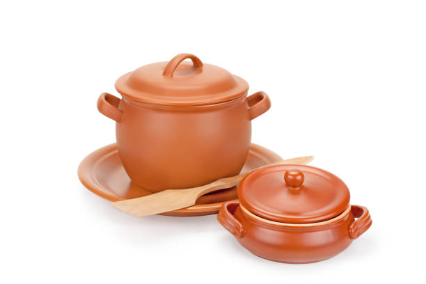 istock clay pot, wooden utensils on a plate 638520548