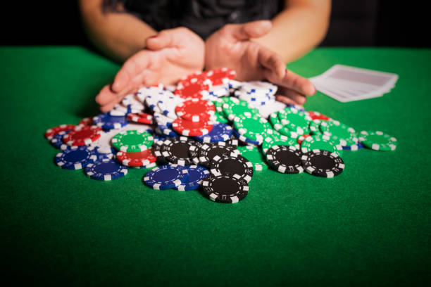 Poker player going all in Poker player going all in child gambling chip gambling poker stock pictures, royalty-free photos & images