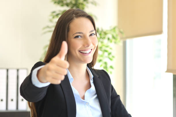 istock Businesswoman posing with thumbs up 638520934