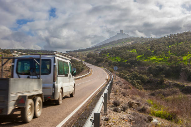istock Van with trailer moving towards Feria Castle Hill 638521272