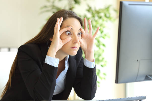 istock Sleepy businesswoman trying to keep eyes opened 638521380