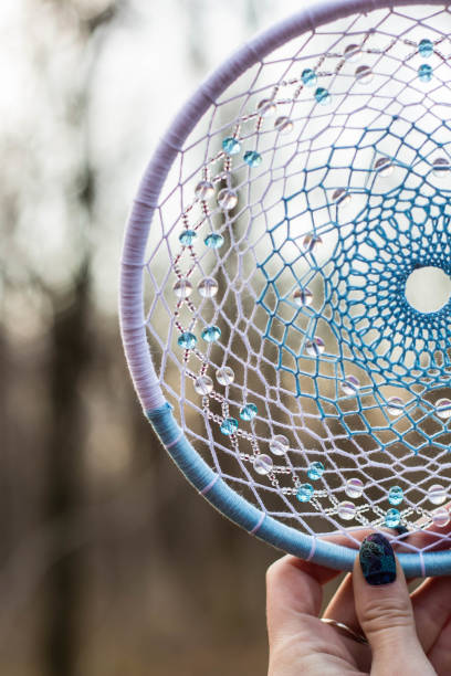 istock Dreamcatcher made of feathers, leather, beads, and ropes 638523216
