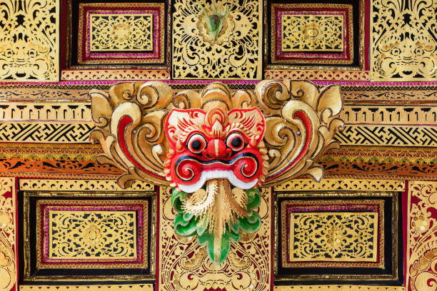 Traditional Barong mask pattern in temple - protective spirit, Bali island symbol. Featured in Balinese dances and ceremonies. Culture, religion, arts festivals of Indonesian people. Travel background