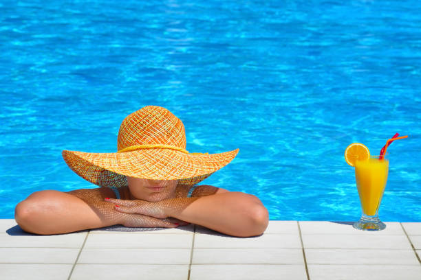 istock Real female beauty relaxing at swimming pool 638527112