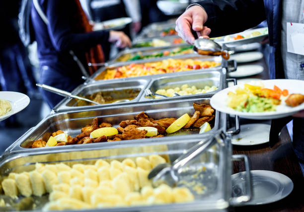 Cuisine Culinary Buffet Dinner Catering Dining Food Celebration Cuisine Culinary Buffet Dinner Catering Dining Food Celebration Party Concept. Group of people in all you can eat catering buffet food indoor in luxury restaurant with meat and vegetables. food service occupation food and drink industry party buffet stock pictures, royalty-free photos & images