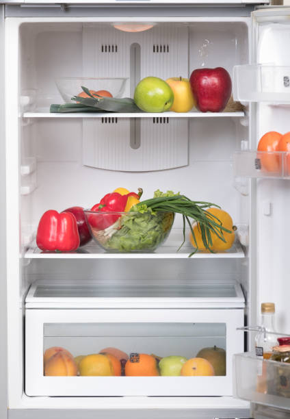 istock Open fridge with fruits and vegetable 638529408