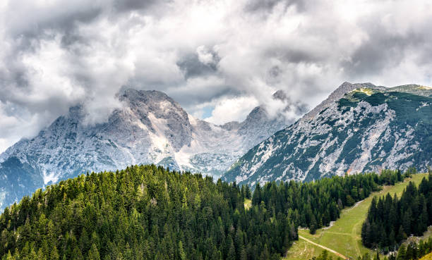 Mountain peeks Jezerska Kocna and Grintavec in Kamnik-Savinja Al Mountain peeks Jezerska Kocna and Grintavec in Kamnik-Savinja Alps. View from snow resort Krvavec in the autumn. Slovenia landscape. krvavec stock pictures, royalty-free photos & images