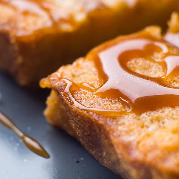 Closeup of apple blonde broiwnies with caramel Home made apple cinnamon blondies with salted caramel. Sweet food dessert macro detail blondy stock pictures, royalty-free photos & images