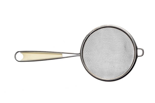 istock Small metallic tea strainer sieve with handle isolated on white. 638529860