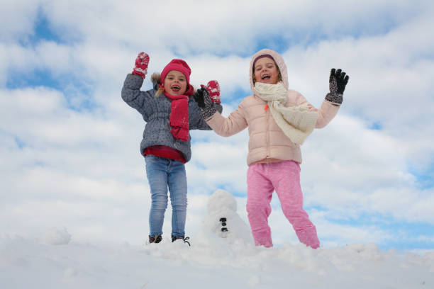 istock Two cute grill in the snow. 638530304