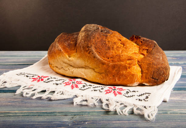 istock Crispy baked bread on wooden tabl 638531838