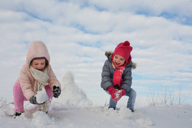 istock Two cute grill in the snow. 638532226