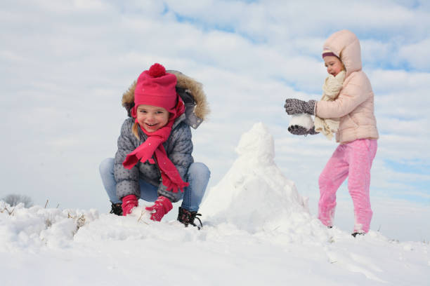 istock Two cute grill in the snow. 638532358