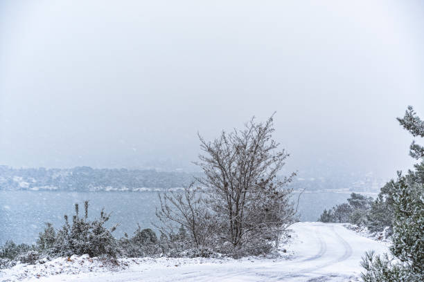 istock Road by the hill under snow 638532790