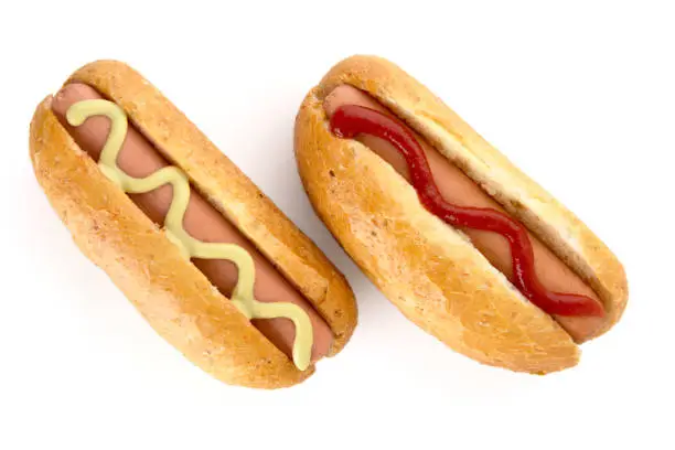 Photo of Hotdogs with mustard and ketchup isolated on white