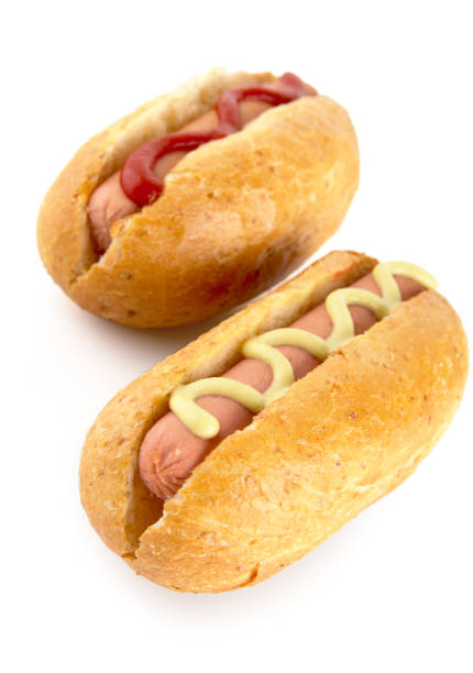 istock Hotdogs with mustard and ketchup isolated on white from above 638535430
