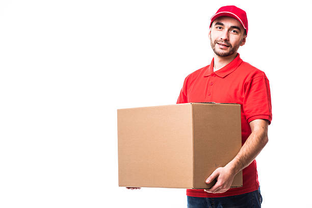 istock Side view of delivery man with box 638535630