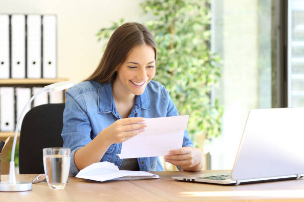 istock Entrepreneur woman reading a letter at office 638535770