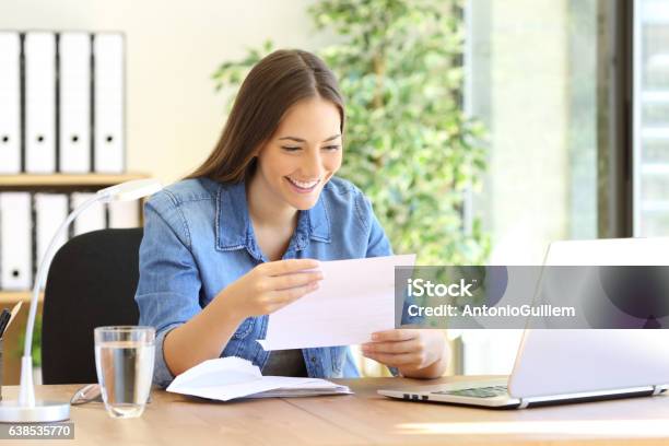 Entrepreneur Woman Reading A Letter At Office Stock Photo - Download Image Now - Opening, Letter - Document, Mail