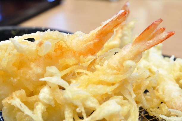 istock Close up tempura shrimp on wooden table. 638536112