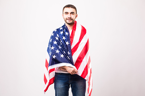 Young handsome man with american flag. Patriot.