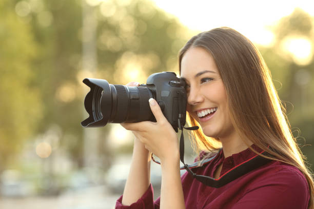 istock Photographer photographing with a digital camera 638536532