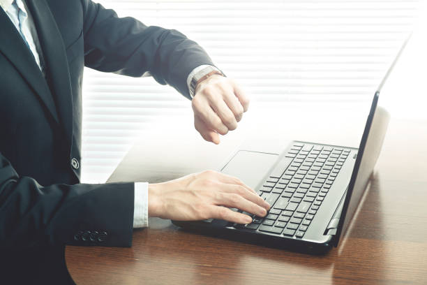 istock Business man looking at watch 638539110