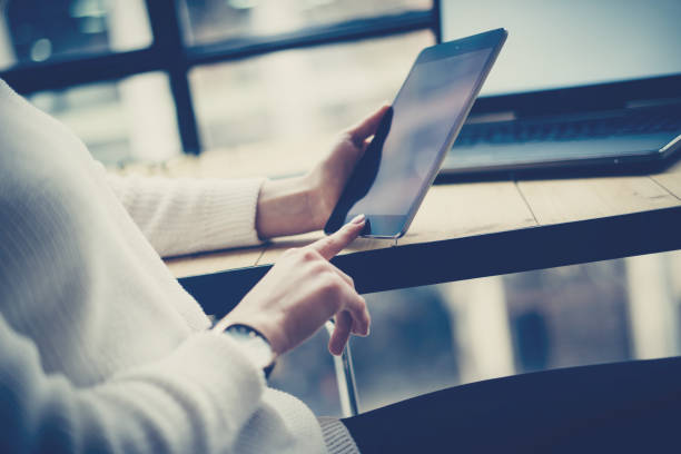 istock Closeup view of female hand touching button on digital tablet 638541766