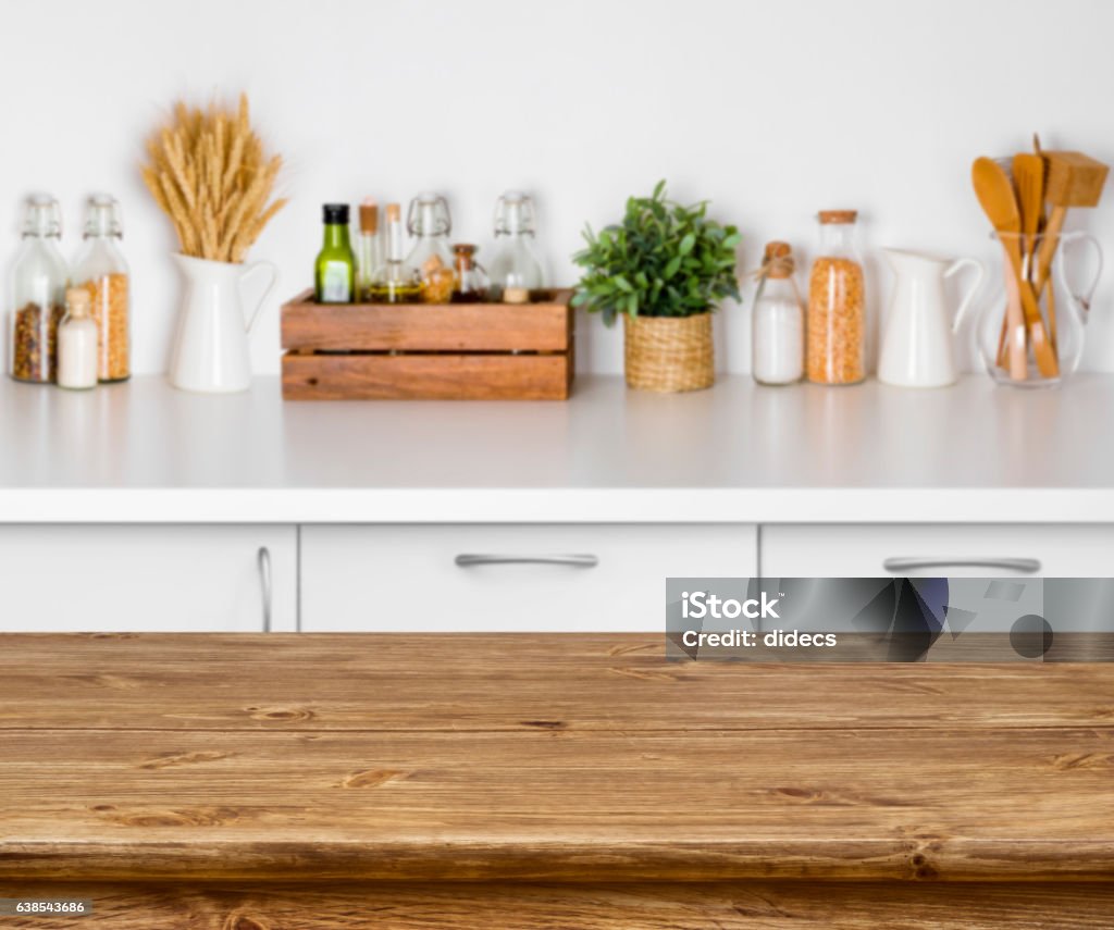 Brown wooden table with bokeh image of kitchen bench interior Kitchen Stock Photo