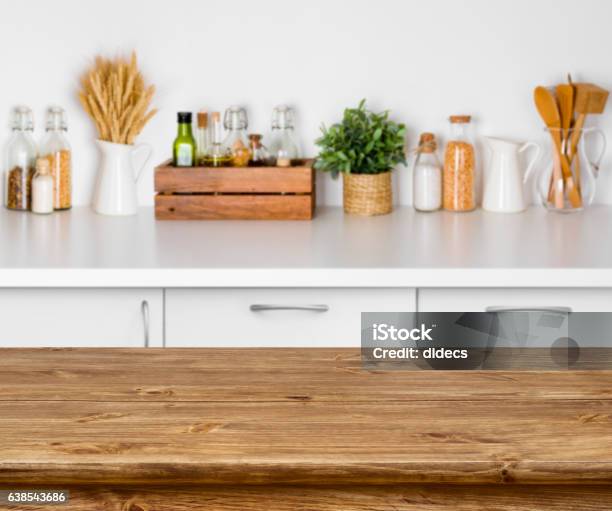 Brown Wooden Table With Bokeh Image Of Kitchen Bench Interior Stock Photo - Download Image Now