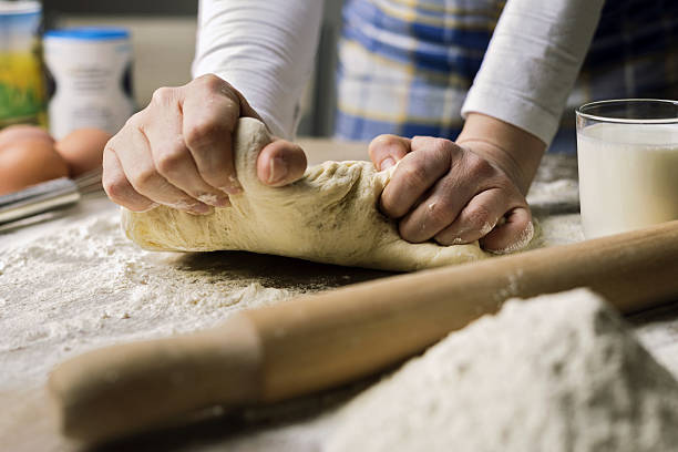 teig  - bread kneading making human hand stock-fotos und bilder