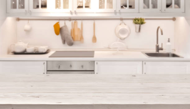 istock Kitchen table top and blur background of cooking zone interior 638543996