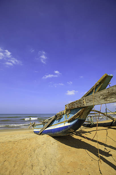 istock old traditional catamaran on the beach 638544052