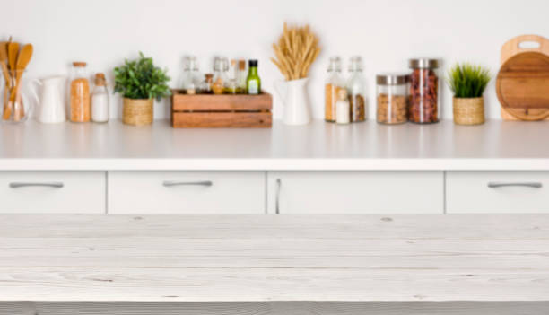 istock Empty wooden table with bokeh image of kitchen bench interior 638544302