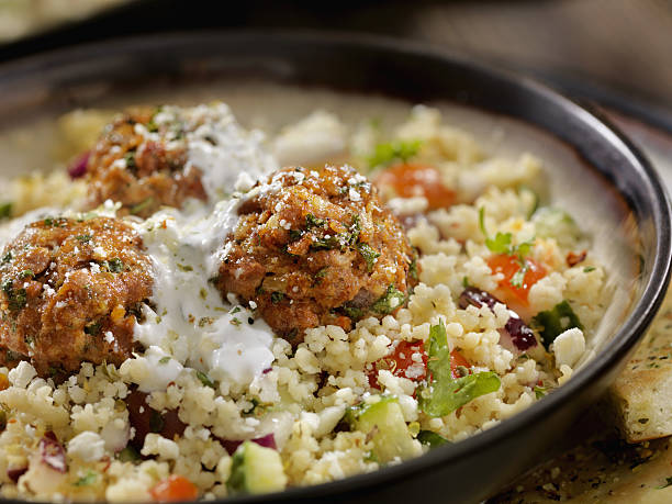 Lamb Meatballs with a Couscous Greek Salad and Tzatziki Lamb Meatballs with a Couscous Greek Salad and Tzatziki  -Photographed on Hasselblad H3D2-39mb Camera african culture food stock pictures, royalty-free photos & images