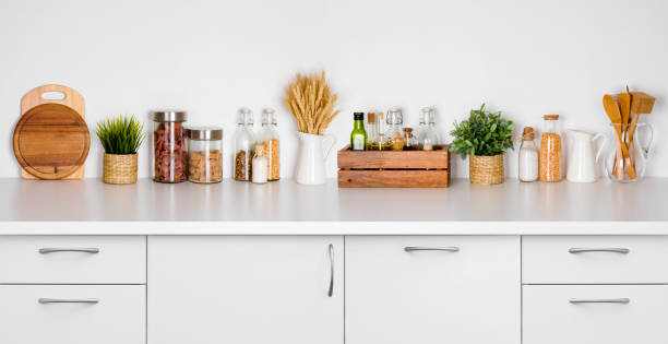 istock Kitchen bench shelf with various herbs, spices, utensils on white 638544884