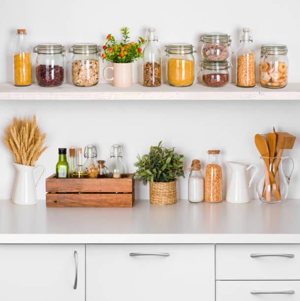 istock Kitchen bench shelves with various food ingredients on white background 638546390