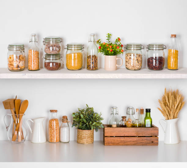 istock Modern kitchen shelves with various food ingredients on white background 638547578