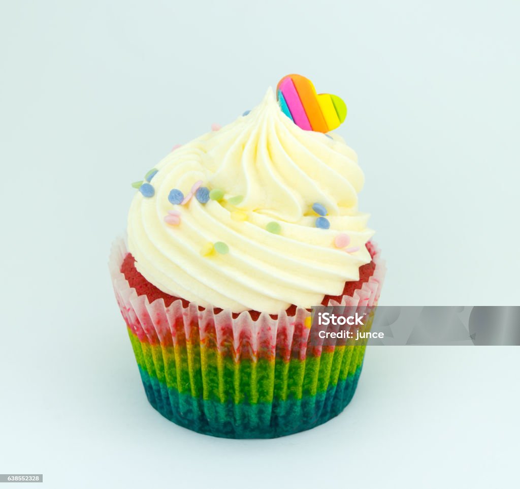 Colorful rainbow cupcake on white background. Cupcake Stock Photo