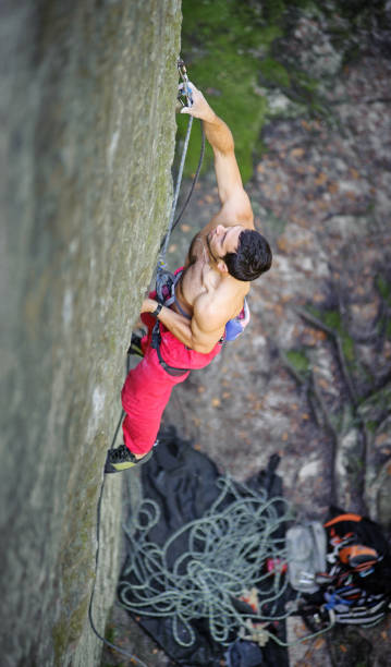 istock Muscular rock climber climbs on overhanging cliff 638553084