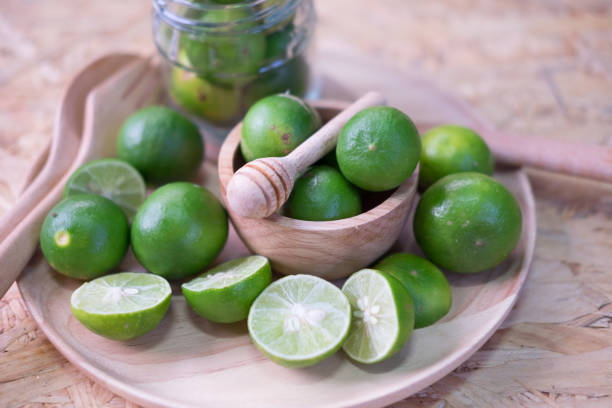 istock Fresh limes in wood bowl 638553146