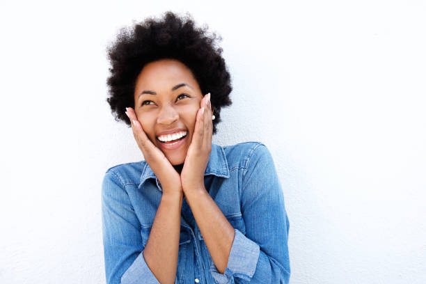 istock Excited young african woman holding face in hands 638555624