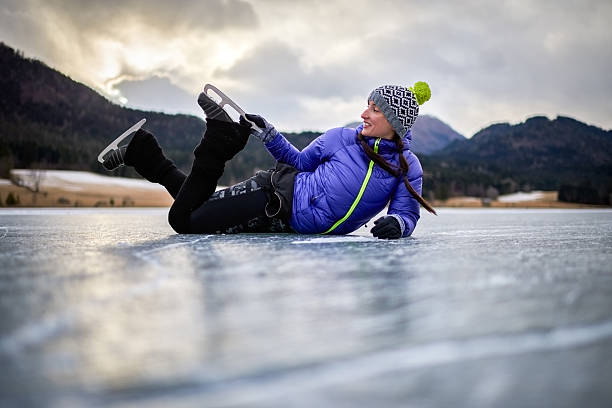 istock Woman lying on frozen lake 638560006