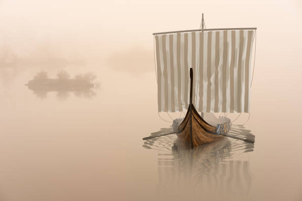 viking ship on the water in the mystical fog. - drakkar imagens e fotografias de stock