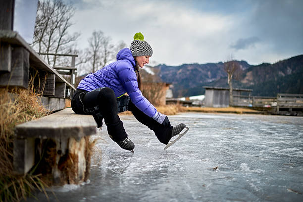 istock Woman fixing ice skate shoe 638560148